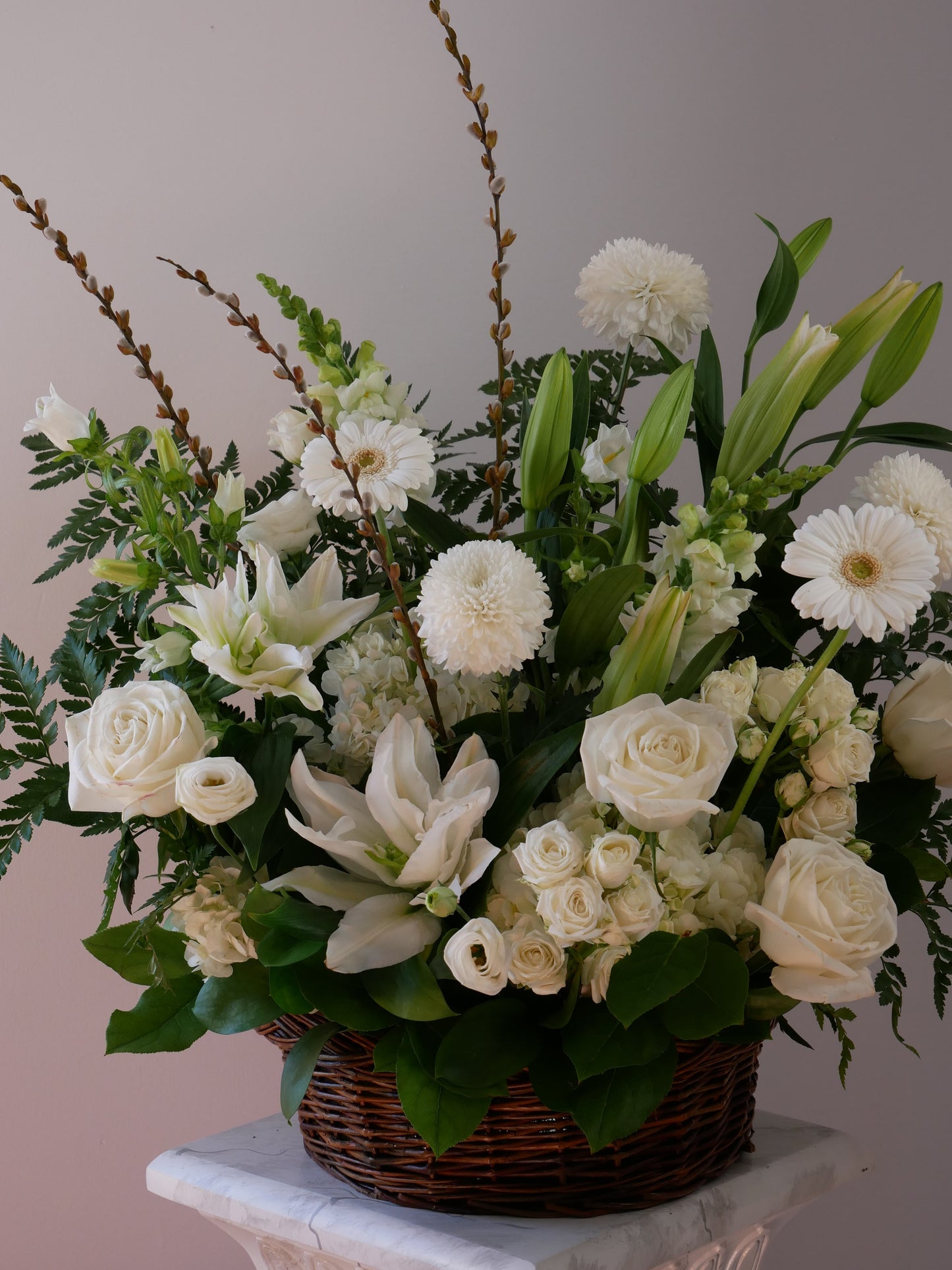 Funeral basket featuring lilies, hydrangeas, chrysanthemum, roses, greens, and more by Floral Esthetics - Cape Cod Local Florist