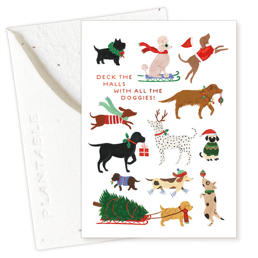Christmas card with illustrations of dogs in festive attire on a white background