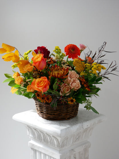 Fall medium size flower basket featuring roses, chrysanthemum, gerberas, leafs and more