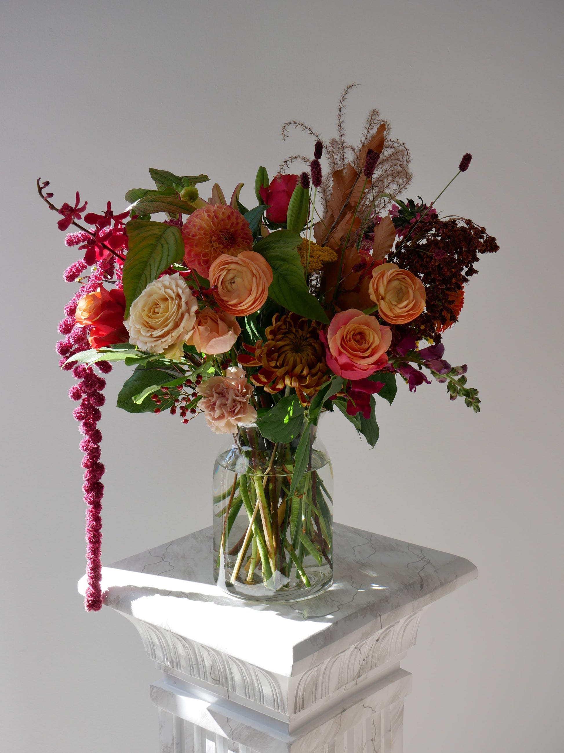 Premium size fall arrangement in vase featuring roses, chrysanthemum, ranunculus, dahlias, seasonal blooms and berries by Floral Esthetics