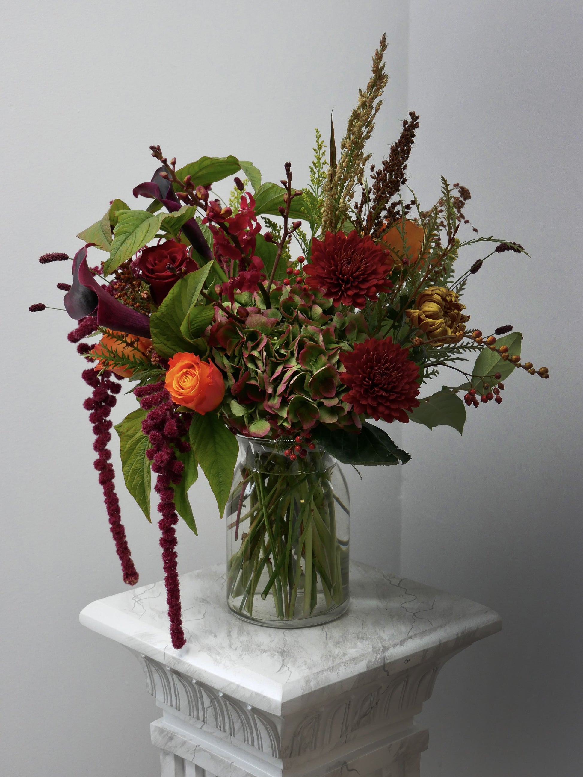 Premium size fall arrangement in vase featuring roses, chrysanthemum, hydrangeas, seasonal blooms and berries by Floral Esthetics
