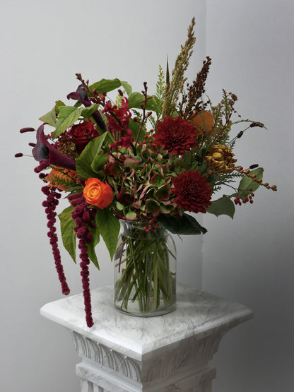 Premium size fall arrangement in vase featuring roses, chrysanthemum, hydrangeas, seasonal blooms and berries by Floral Esthetics