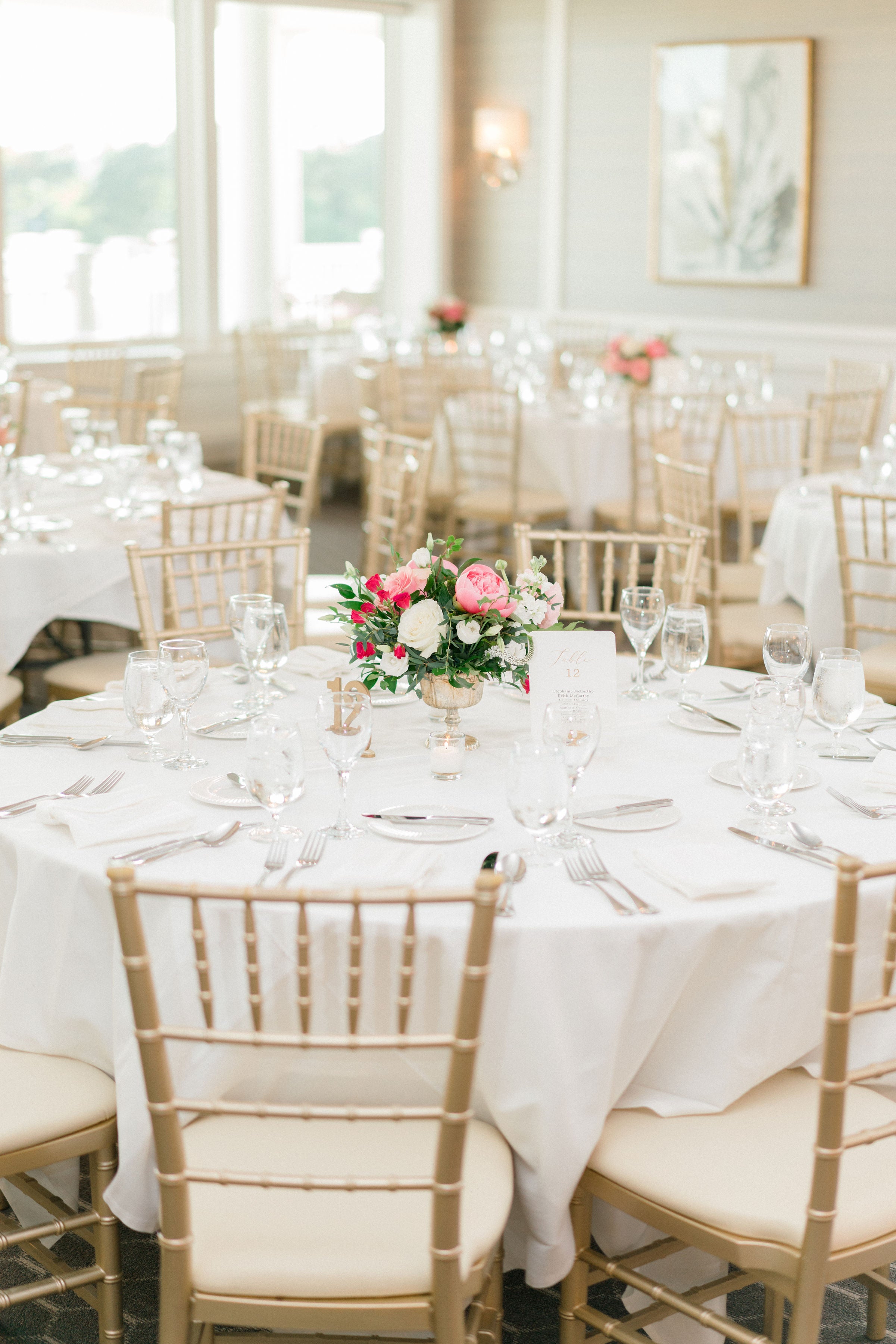 Table centerpieces with pink peonies by Floral Esthetics for Cape Cod wedding