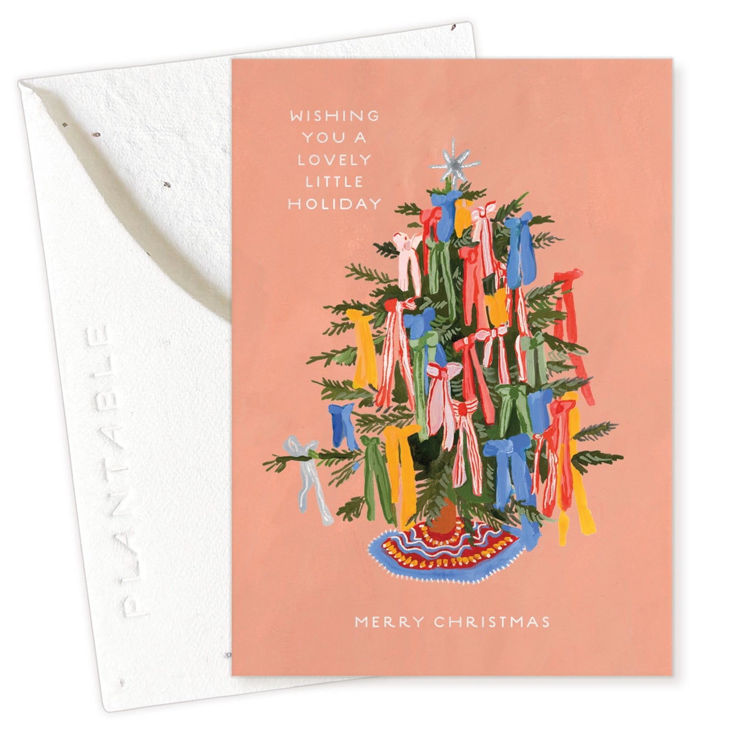 Christmas card with a decorated tree and colorful ribbons on a pink background