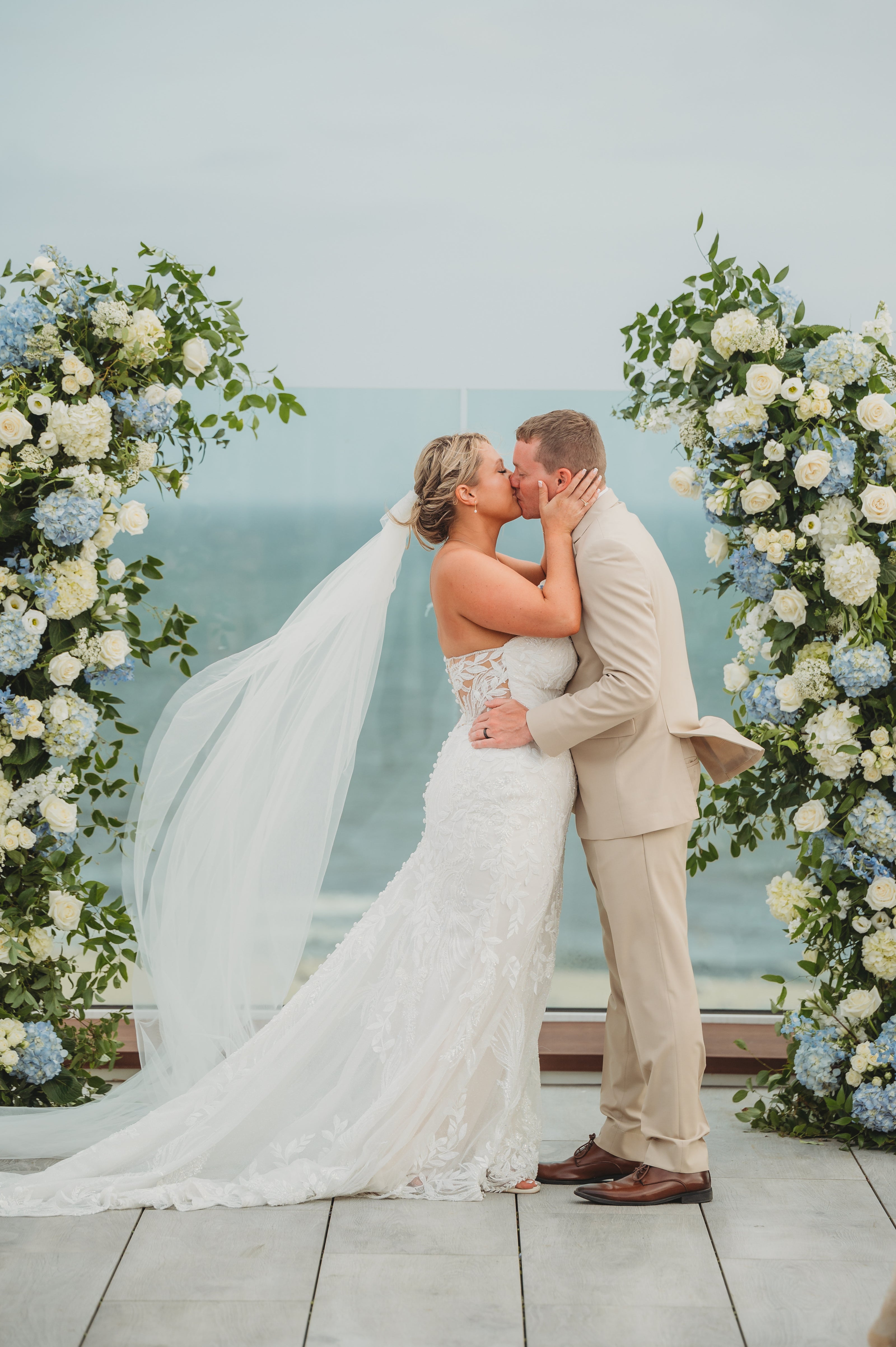 Classic Cape Cod wedding floral pillars with blue and white hydrangeas, roses, lisianthus, and greenery by Floral Esthetics at Wychmere Beach Club 