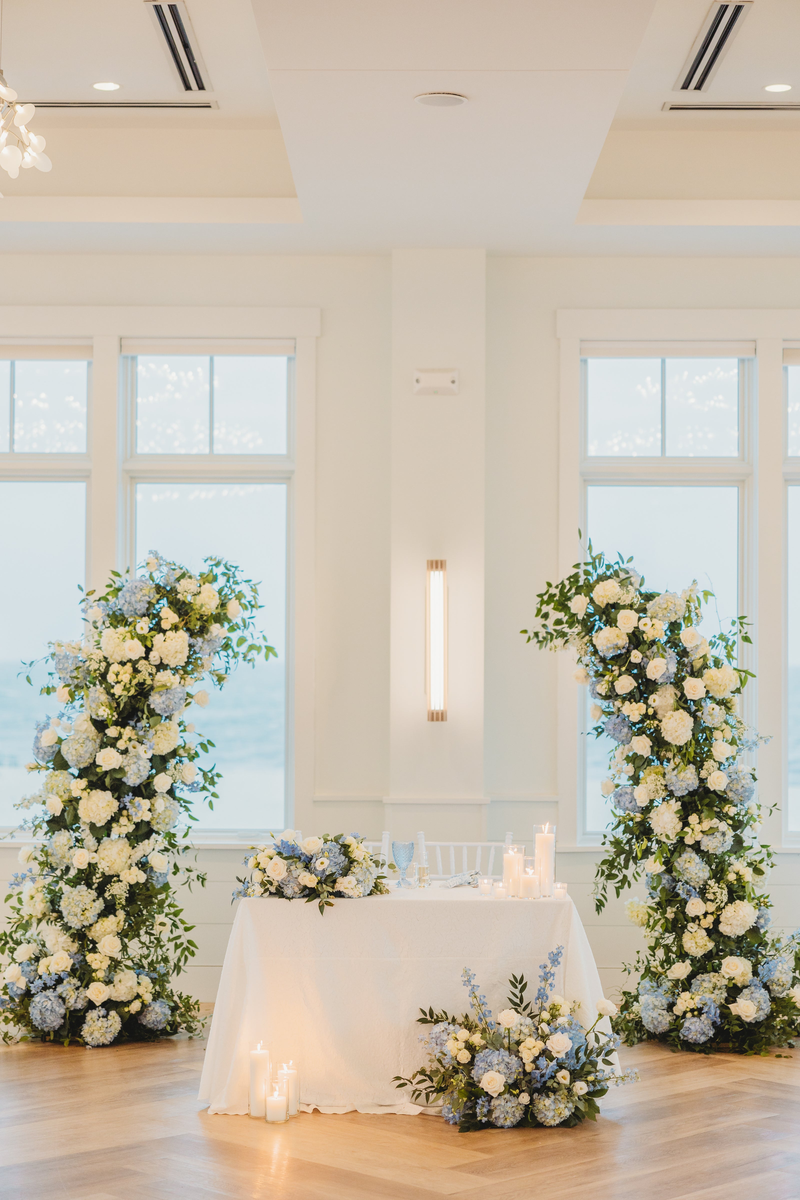 Classic blue and white cape cod wedding setup by Floral Esthetics at Wychmere Beach Club