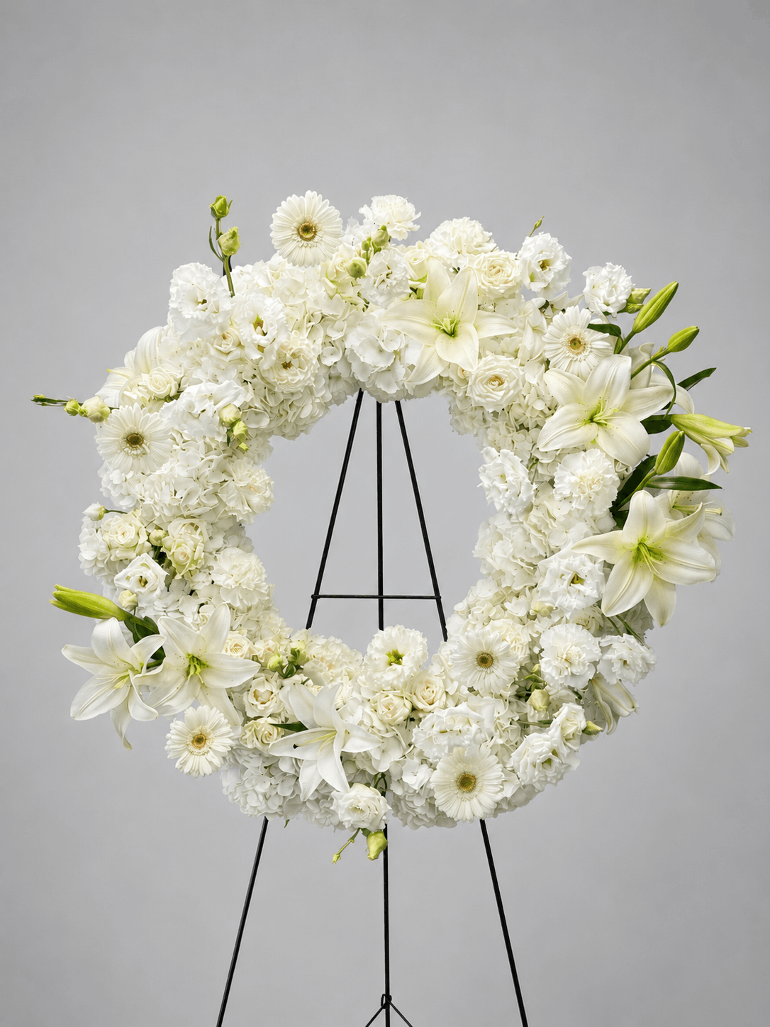 White floral wreath on a gray background