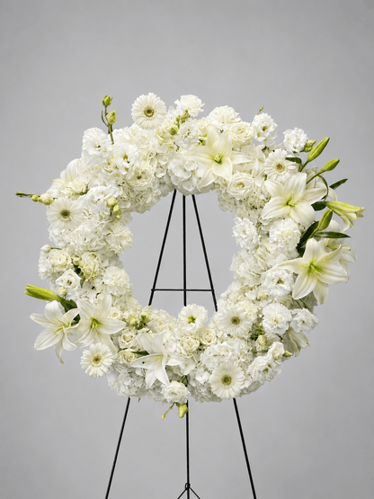 White floral wreath on a gray background