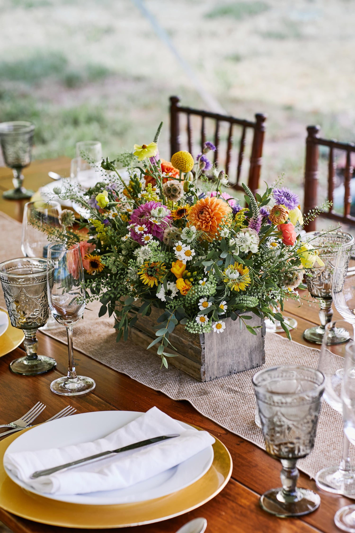 Farm table centerpieces with seasonal blooms in Cotuit by Floral Esthetics