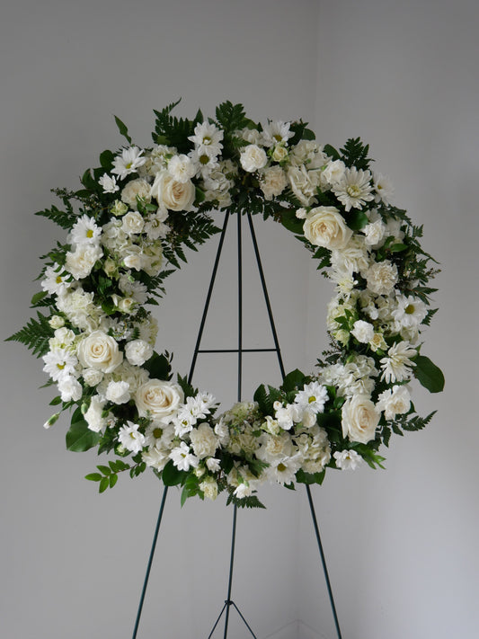 funeral floral wreath featuring hydrangeas, roses, spray roses, chrysanthemum, carnations and more by Floral Esthetics - Barnstable Florist