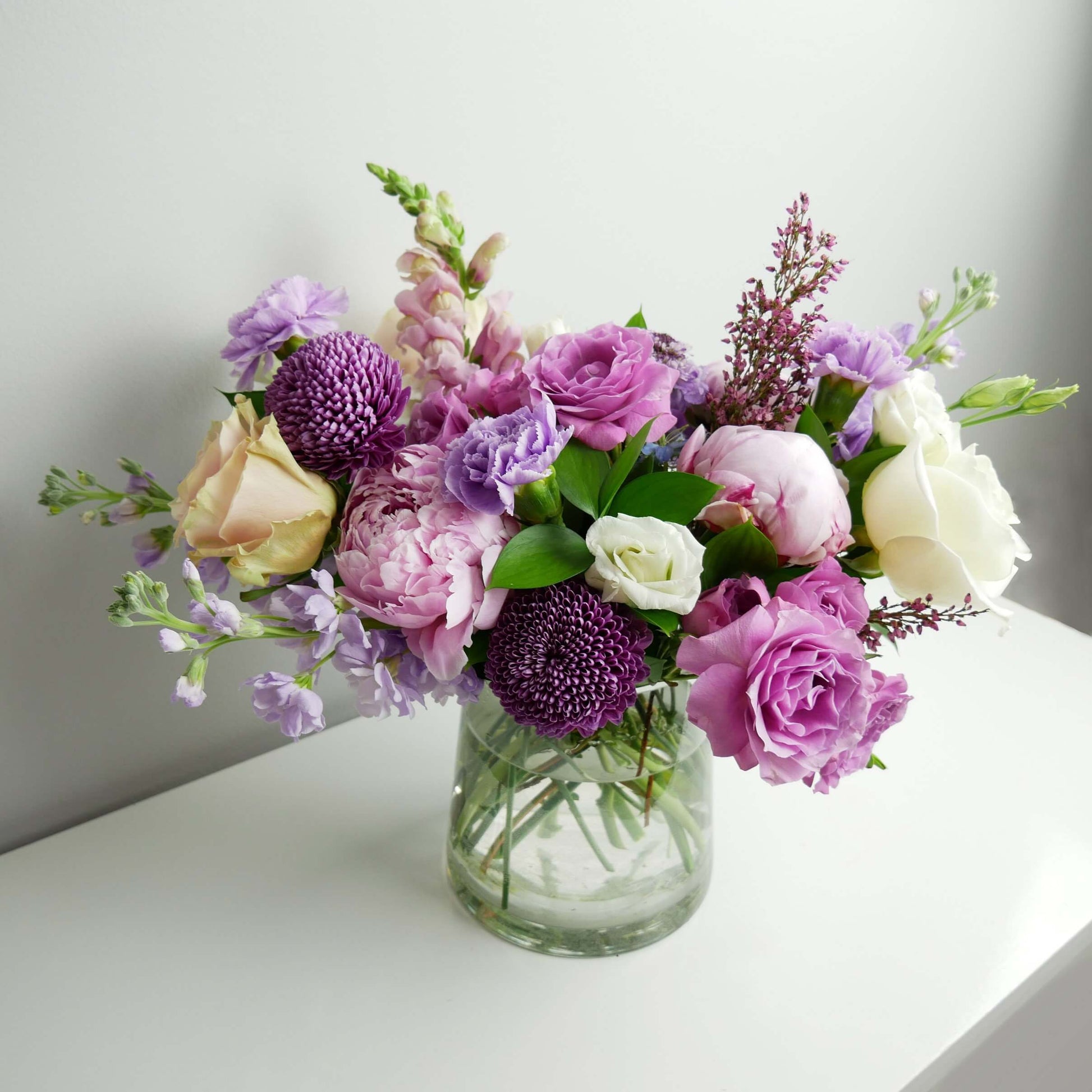White and purple arrangement in vase